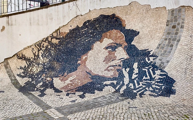 aAmalia Rodrigues paver mural in the Alfama neighborhood