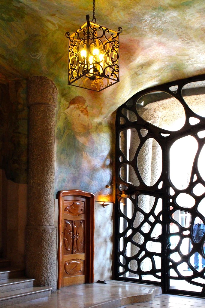 the butterfly-like wrought iron entrance to La Pedrera