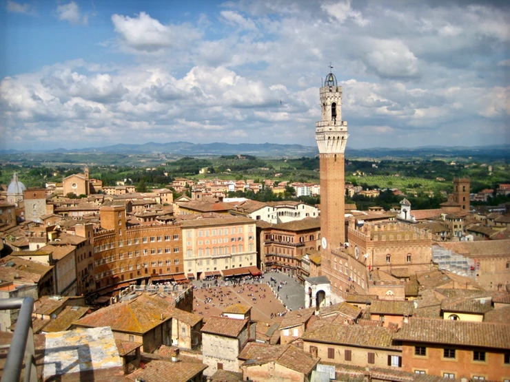 view of the Piazza del Campo and Palazzo Pubblico from the viewing terrace of the Facciati