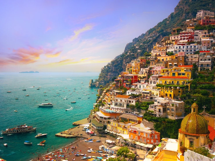 pastel houses cascading down the hills in Positano