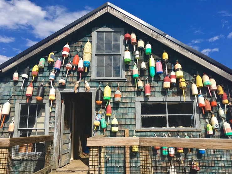 traditional Maine lobster shop, decorated with buoys, in Bar Harbor