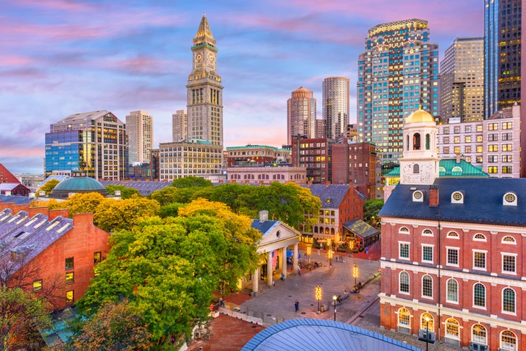 Boston skyline with Faneuil Hall and Quincy Market at dusk