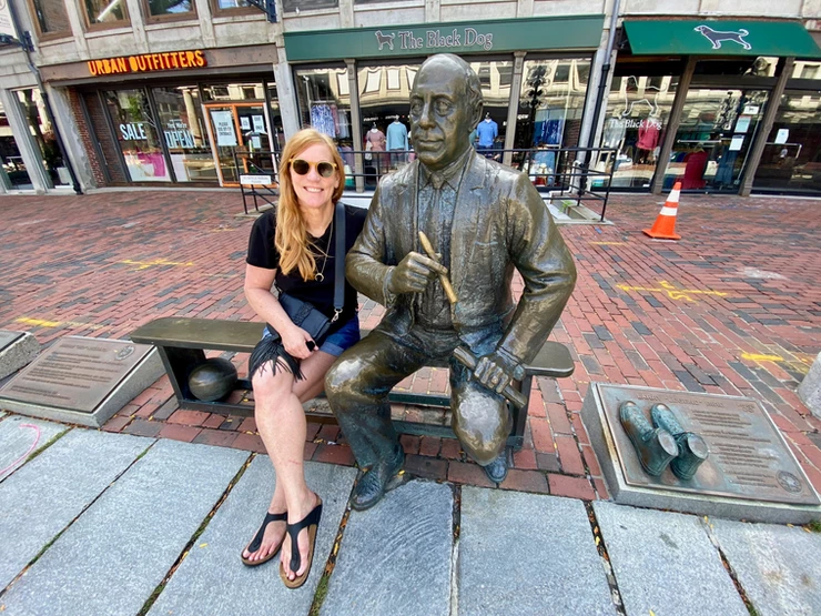 me with the Red Auerbach statue outside Quincy market at Faneuil Hall