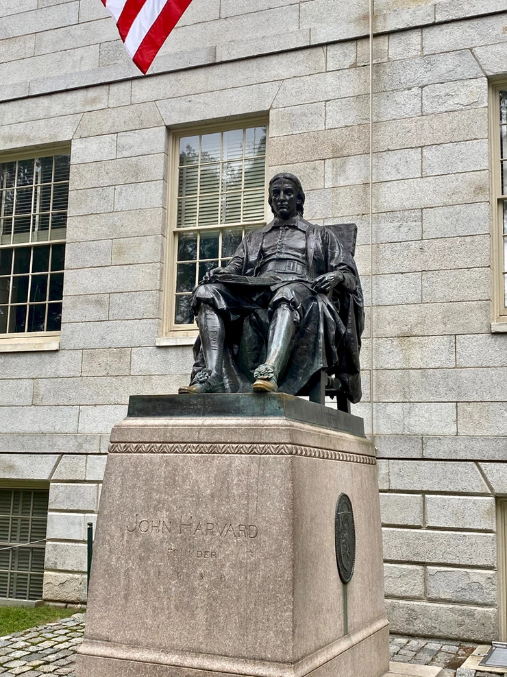 statue of John Harvard in Harvard Yard