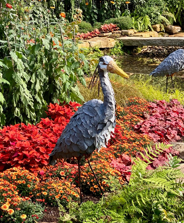 a blue heron made of plant materials in the East Room at the Phipps