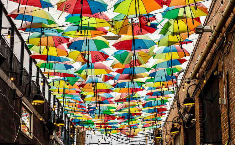 umbrella street decorations in a narrow alley of RiNo 