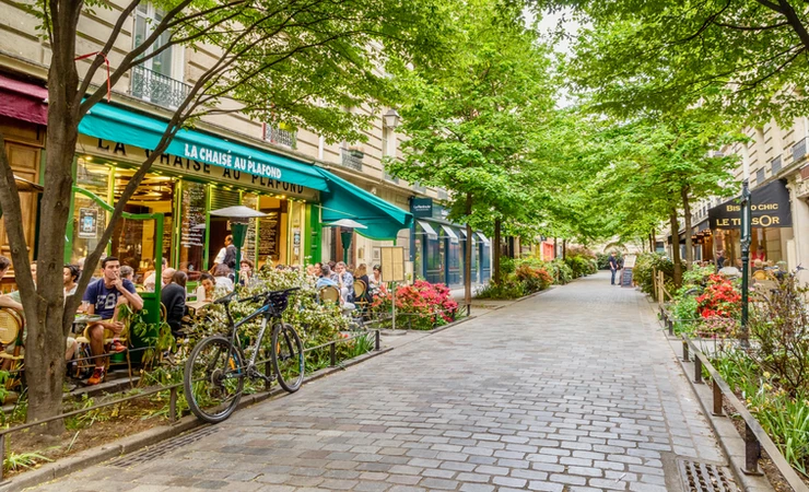 cafe lined street in the Marais