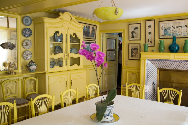 the the bright yellow dining room in Monet's Giverny house