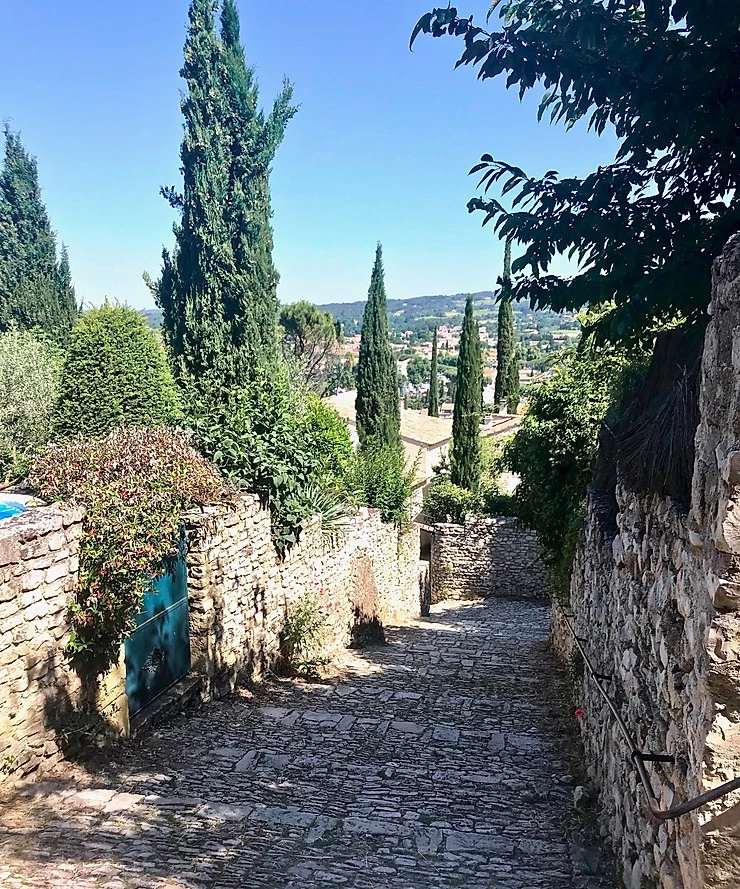 pretty cobbled streets and cypress trees in the medieval part of Vaison-La-Romaine
