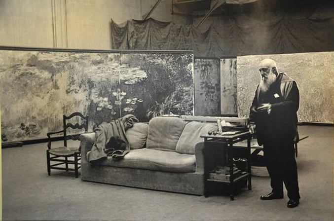 Monet in his Giverney studio working on his water lily paintings.  Image source: Wikimedia Commons