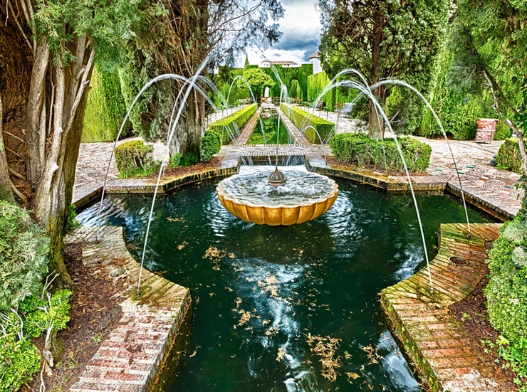 fountain in the famous avenue of cypress trees in the Alhambra's Generalife Gardens