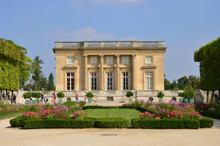 the Neoclassical limestone facade of the Petit Trianon at Versailles