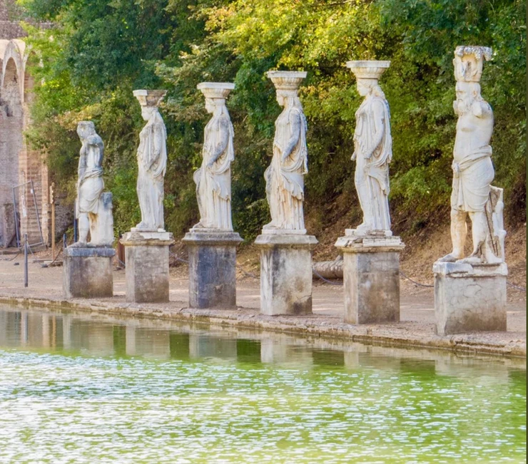 statues lining the pool of the Canopus