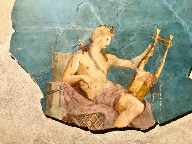 Fragment of a fresco from the House of Augustus in the Palatine Museum. The home had many references to the god Apollo.