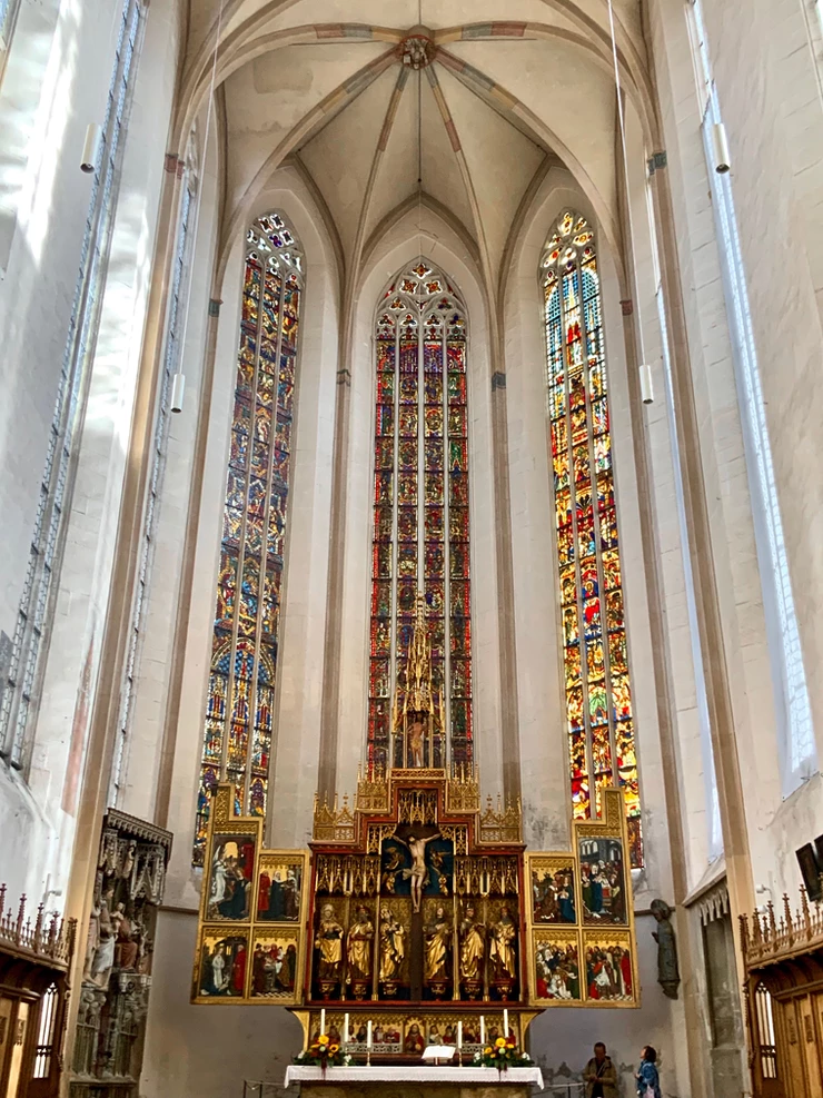 altar and stained glass in St. Jakob's Church