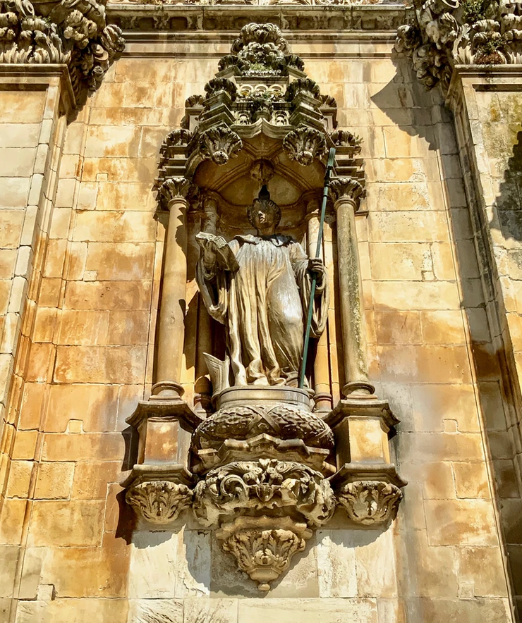 statue of St. Benedict on the facade of Alcobaça Monastery