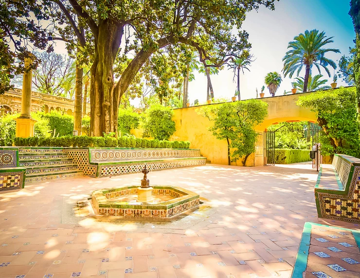 tiled benches and fountain in the Alcazar Gardens