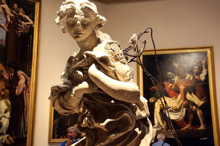 a Bernini angel and Caravaggio's Deposition
