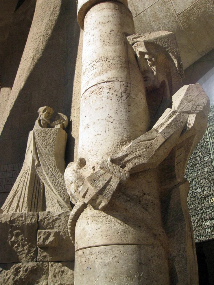 the flagellation column -- Jesus being whipped with the face of Gaudi