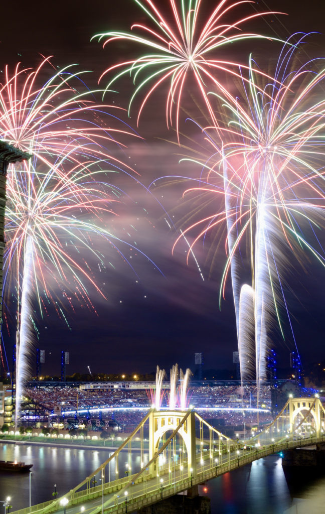fireworks above Roberto Clemente Bridge and PNC Park