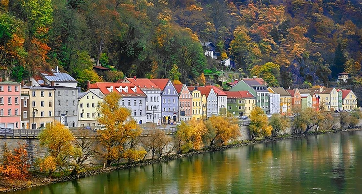 colorful houses lining the banks of the Danube River in Passau Germany