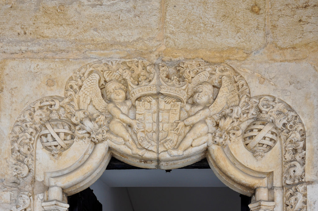 bas-relief with the coat of arms of Portugal on the lintel of a monastery door