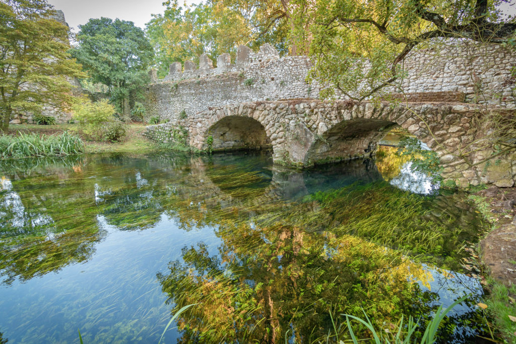 ancient stone bridge in Ninfa Gardens