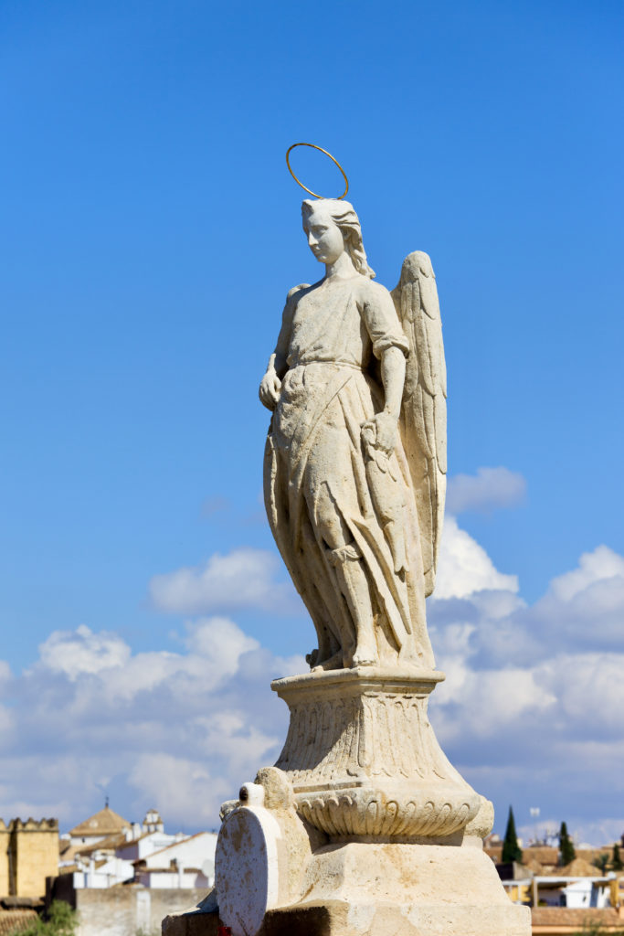 Archangel Raphael statue from 1651 by Bernabe Gomez del Rio on the Roman Bridge 