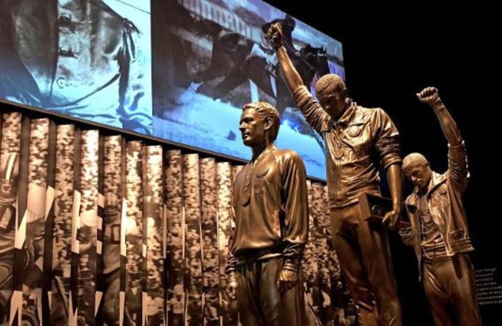 statue depicting the famous medal stand protest by Tommie Smith and John Carlos at the 1968 Olympics