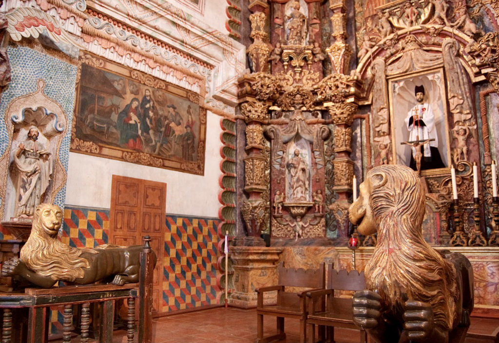 details of the retable with whimsical sculptures