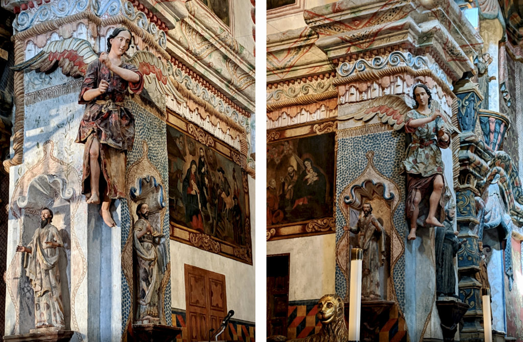 the carved angels on each side of the retable