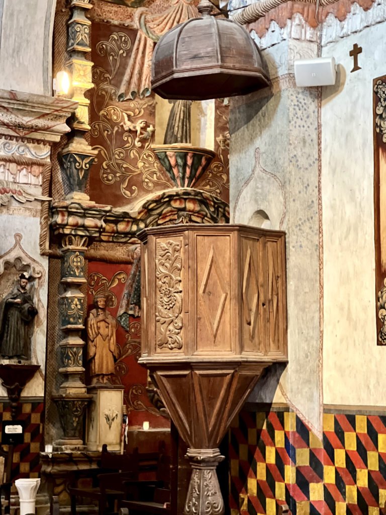 the carved wood pulpit