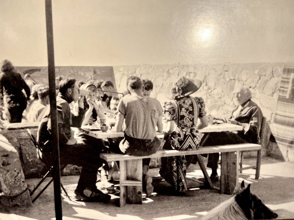 photo of Wright, his wife, and his team in their first dining room