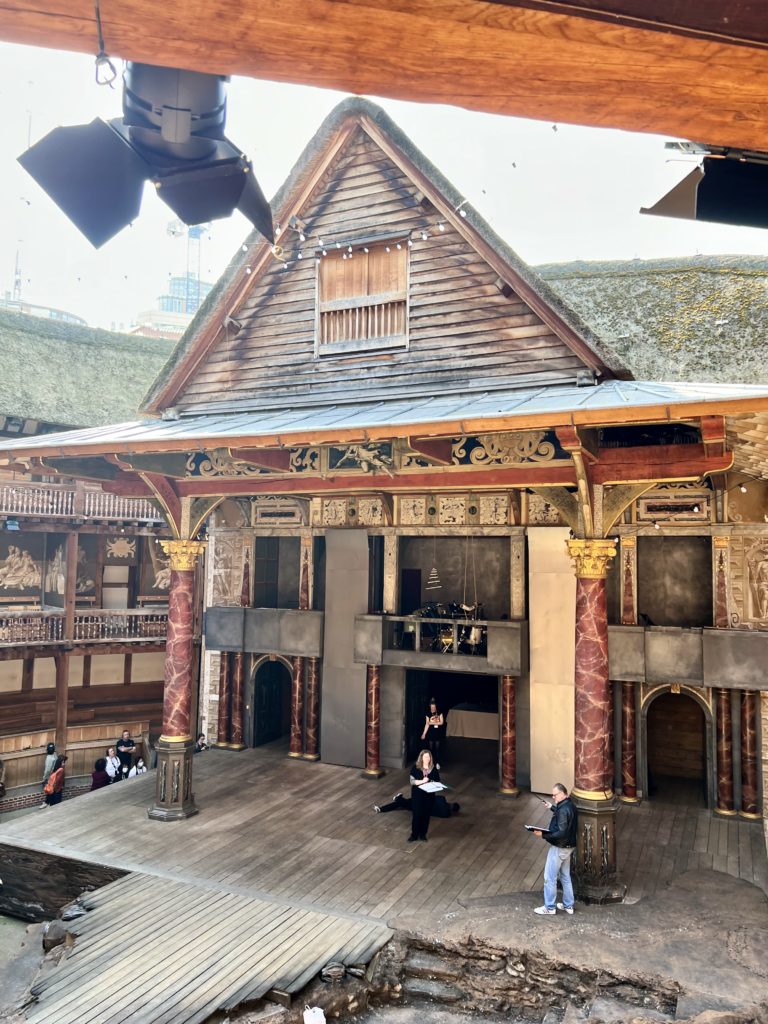actors rehearsing in the Globe Theater