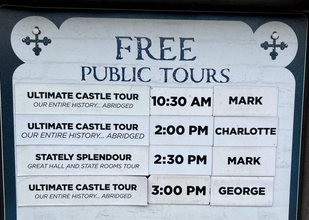 the castle offers free tours listed on signage