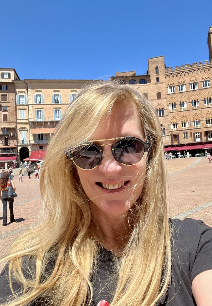 enjoying my time in the Piazza del Campo, where the Palio is held