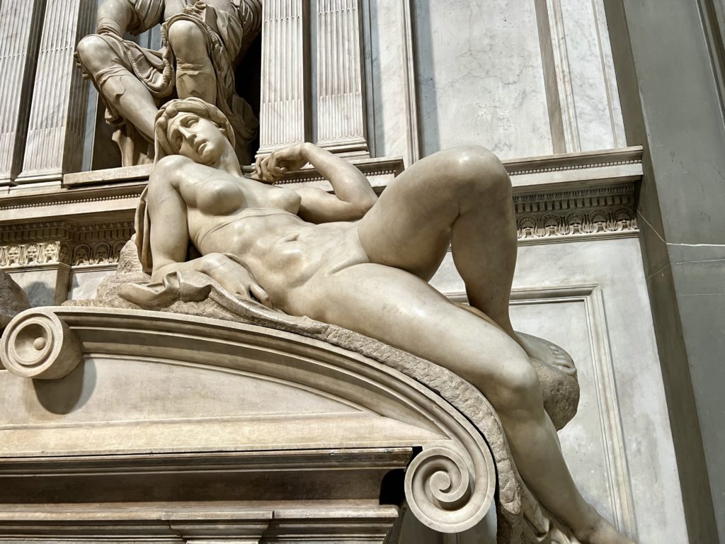 sculpture of Dawn on the tomb of Lorenzo