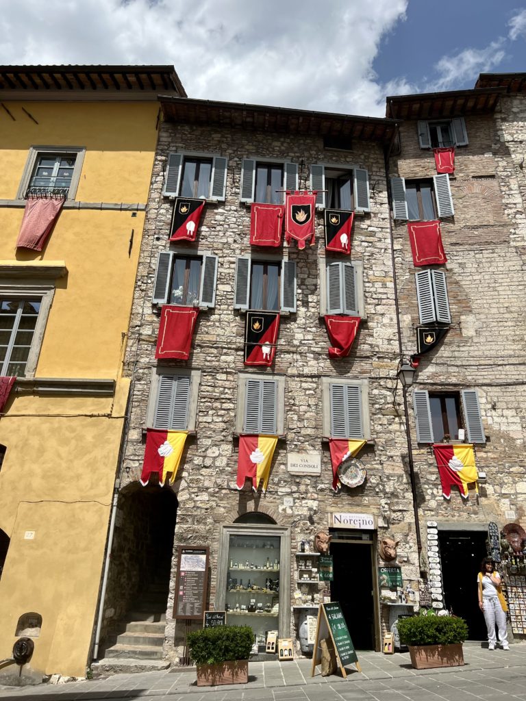 colorful flags representing a neighborhood of Gubbio