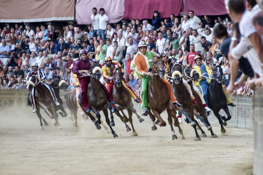 riders compete in the Palio