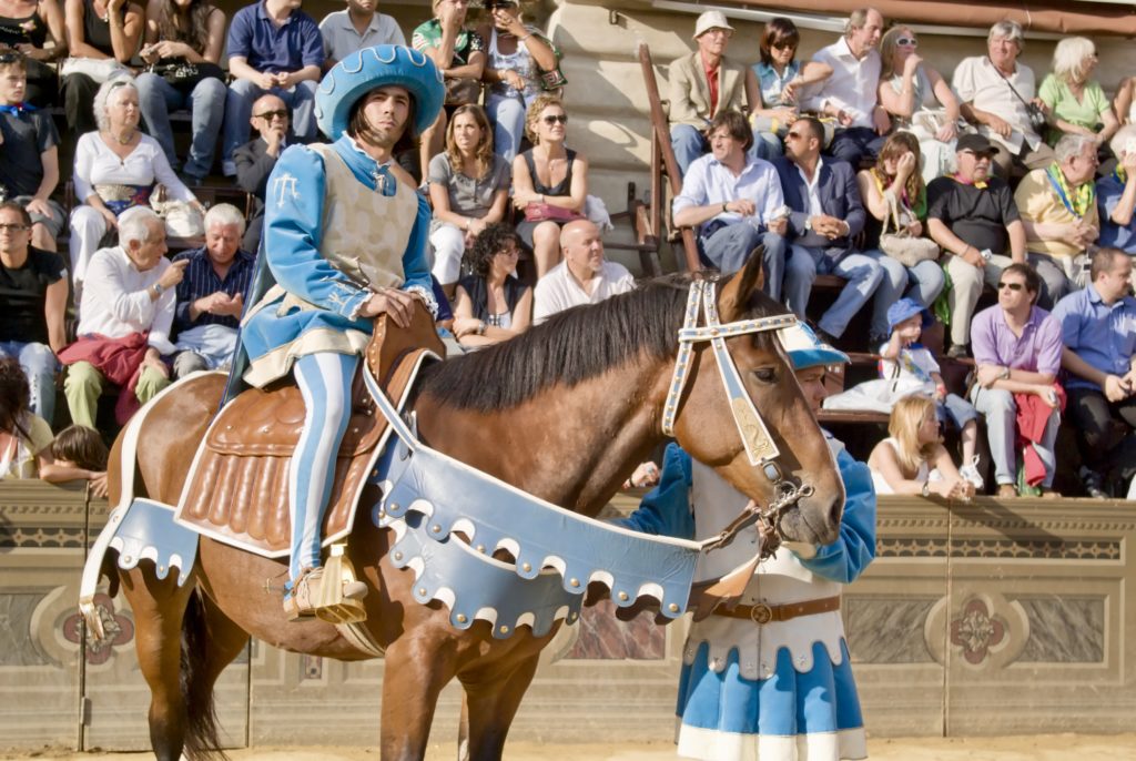 horse and jockey of the contrada Onda (Wave) during the parade 