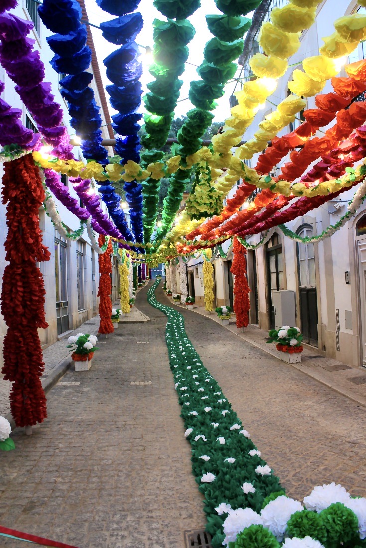 flowers lining the street during the Festival dos Tabuleiros