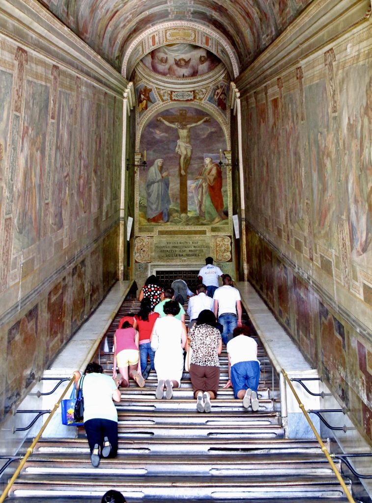 people climbing the Holy Stairs