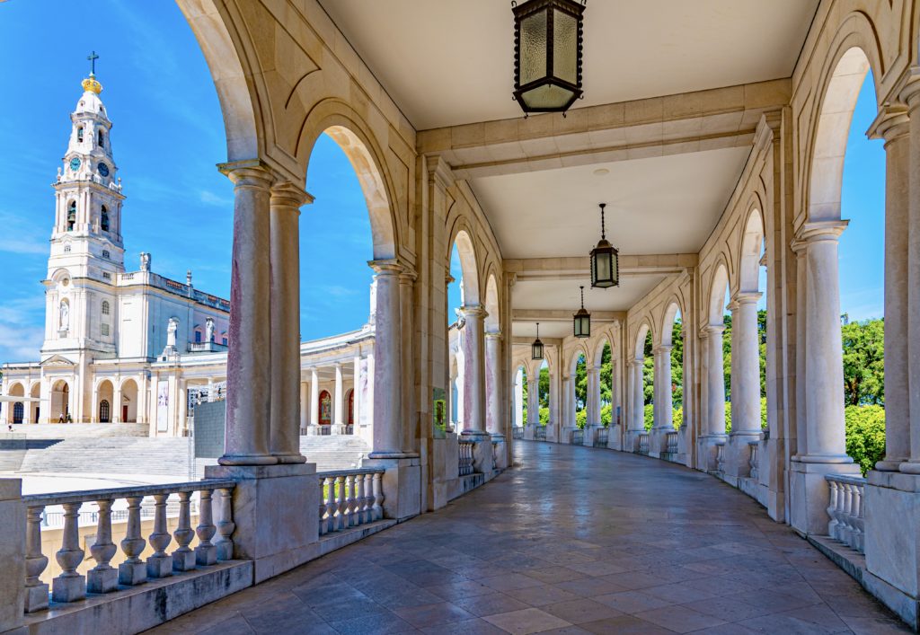 portugal places to visit in lisbon arcade of the famous sanctuary of Fatima, a great day trip from Lisbon if you're on the monastery trail