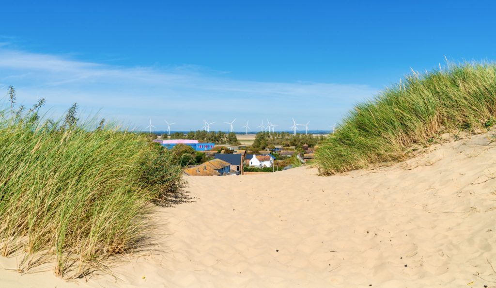 Camber Sands Beach with the town of Rye in the background