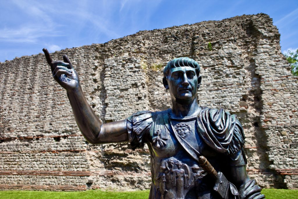 statue of Roman Emperor Trajan and the remains of London Wall on Tower Hill