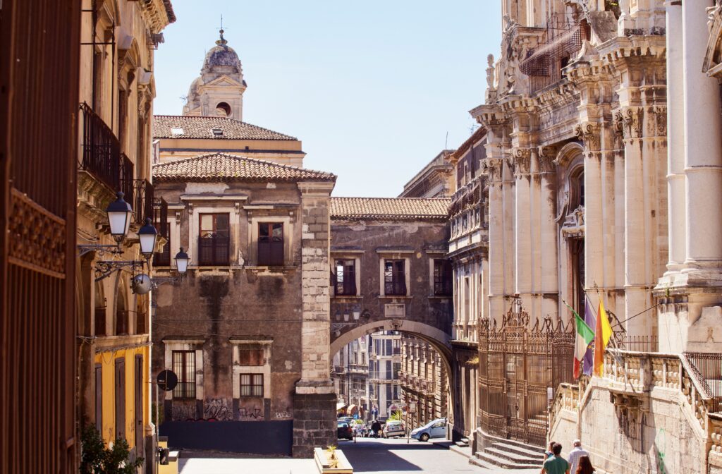 view of Via dei Crociferi and San Benedetto Arch 