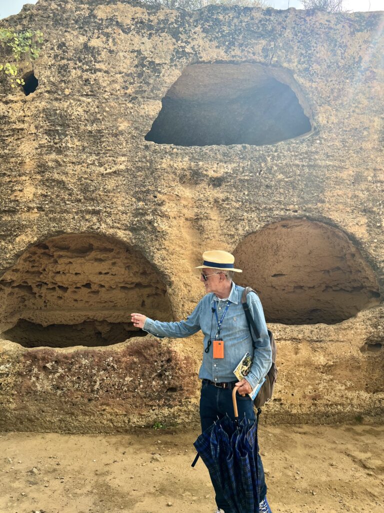 our guide Michele pointing out burial holes in Agrigento