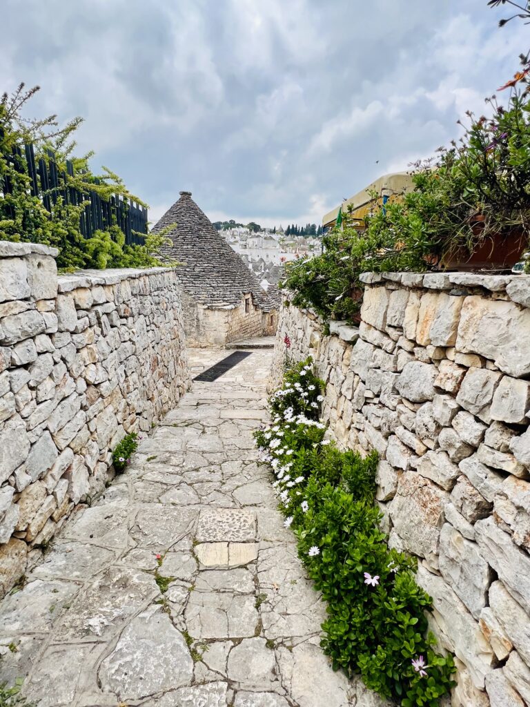 lane in Alberobello with a view of the trulli