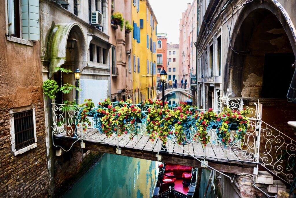 flowers on the bridge over a narrow canal