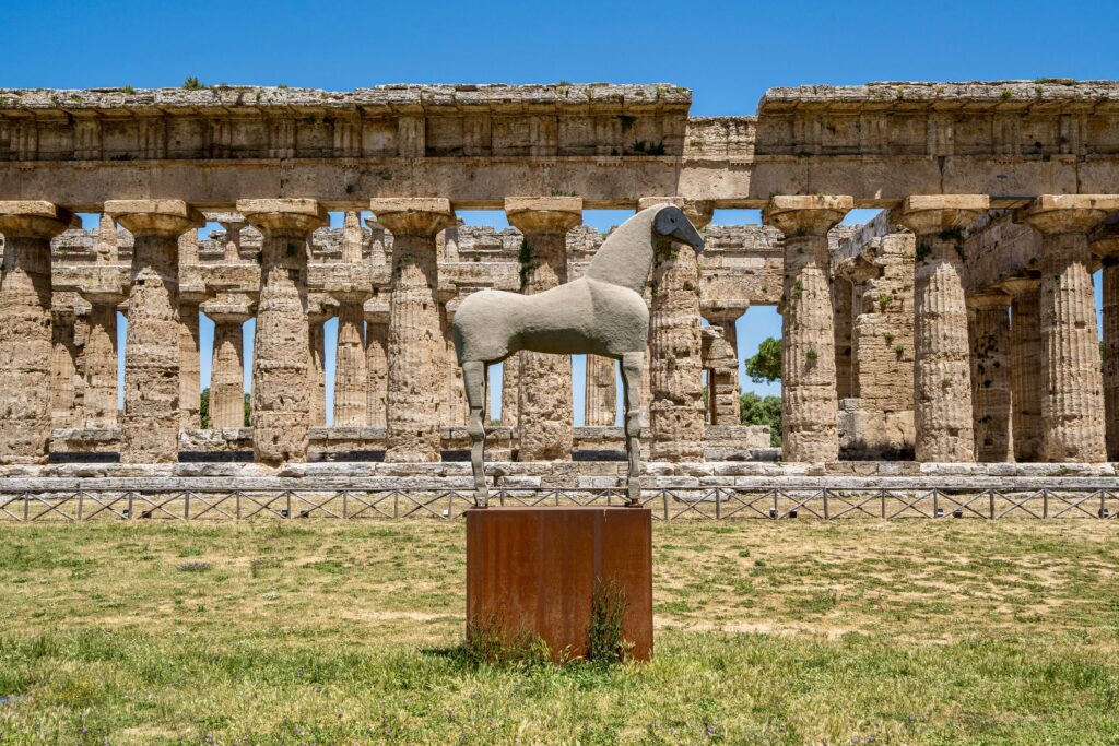 horse sculpture in front of the temples of Paestum